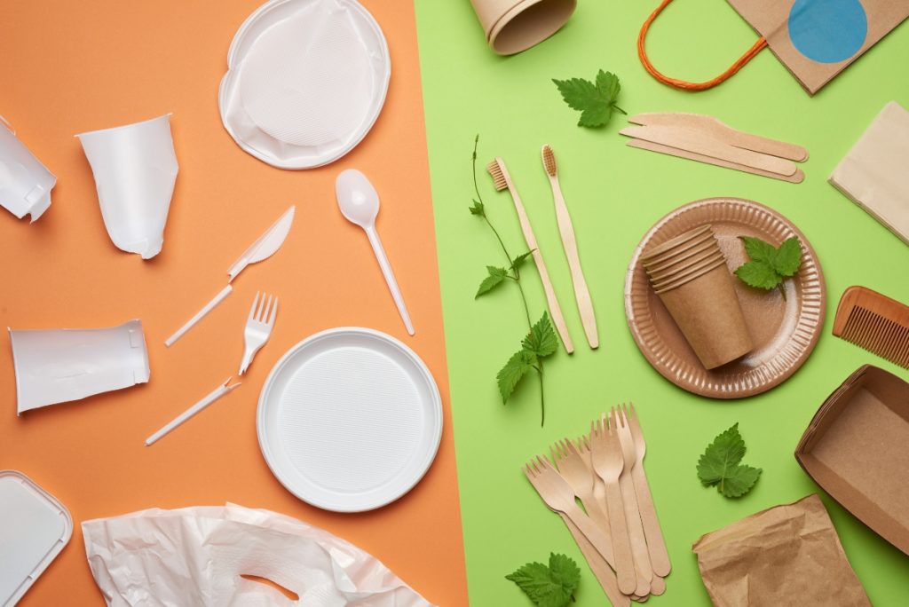 An image showing non-biodegradable, plastic disposables versus wooden and paper green alternatives, which are important for hotel hygiene and sustainability